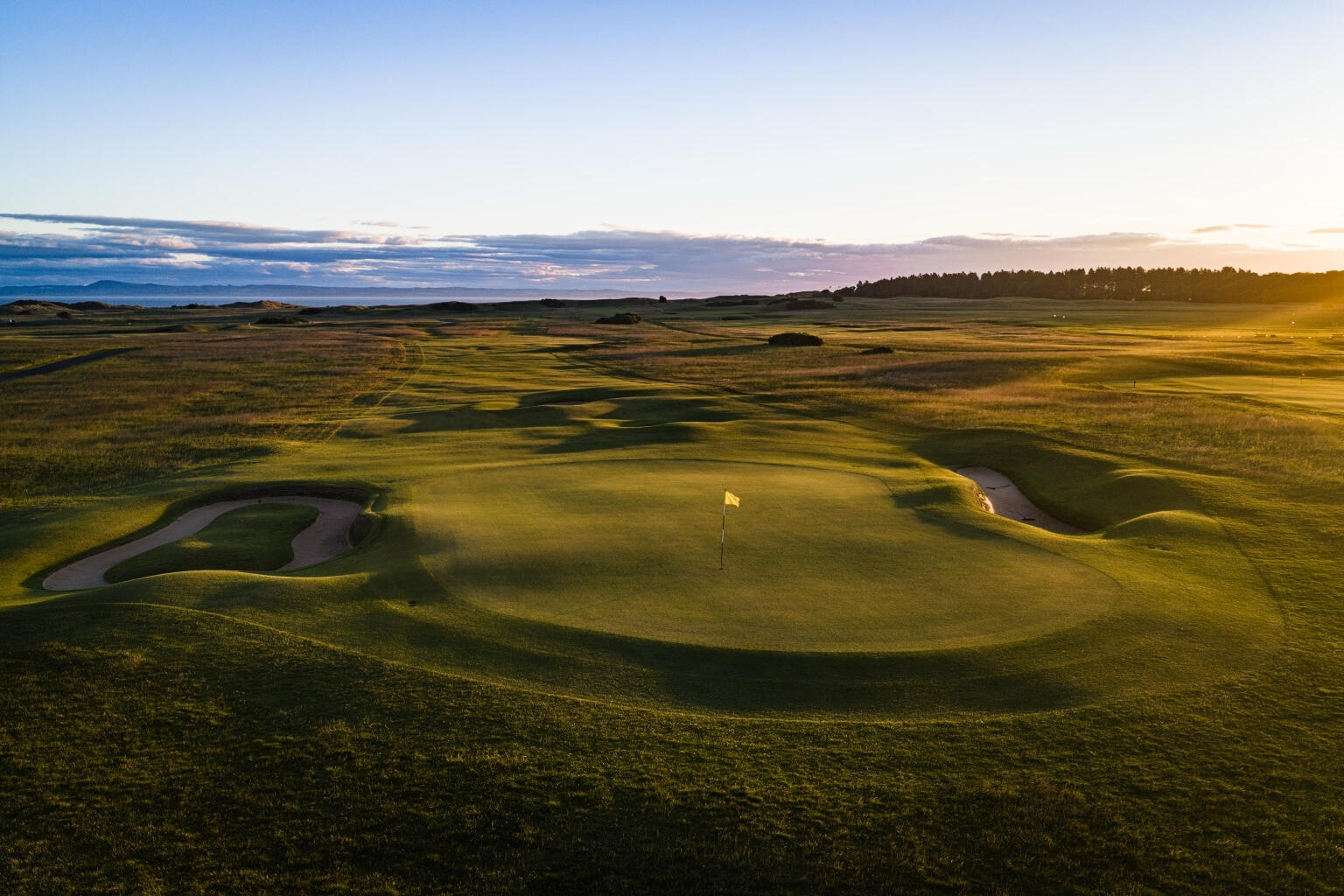 Muirfield Golf Club in warm evening light, photographed from the air